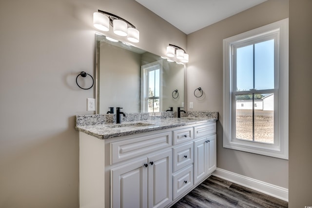 bathroom featuring vanity and hardwood / wood-style flooring