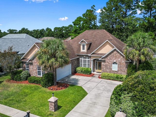 view of front facade featuring a garage and a front lawn