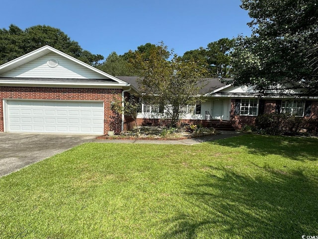 ranch-style house featuring a garage and a front lawn