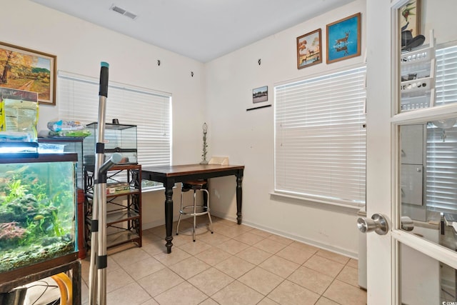 office space with light tile patterned flooring