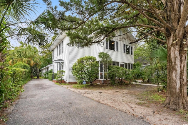 view of property exterior with driveway