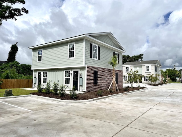 6306 Somerset Dr, Myrtle Beach, SC 29572 - view of property exterior with fence and brick siding