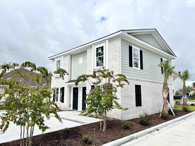 6306 Somerset Dr, Myrtle Beach, SC 29572 - view of front of house featuring a patio and brick siding