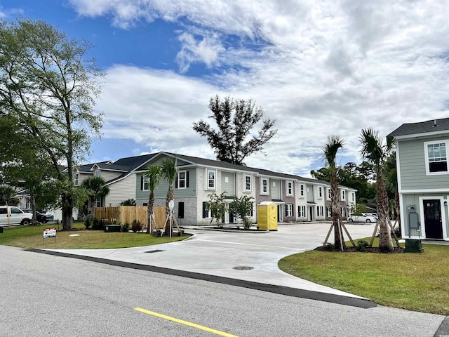 6306 Somerset Dr, Myrtle Beach, SC 29572 - view of front facade with fence, a residential view, and a front lawn