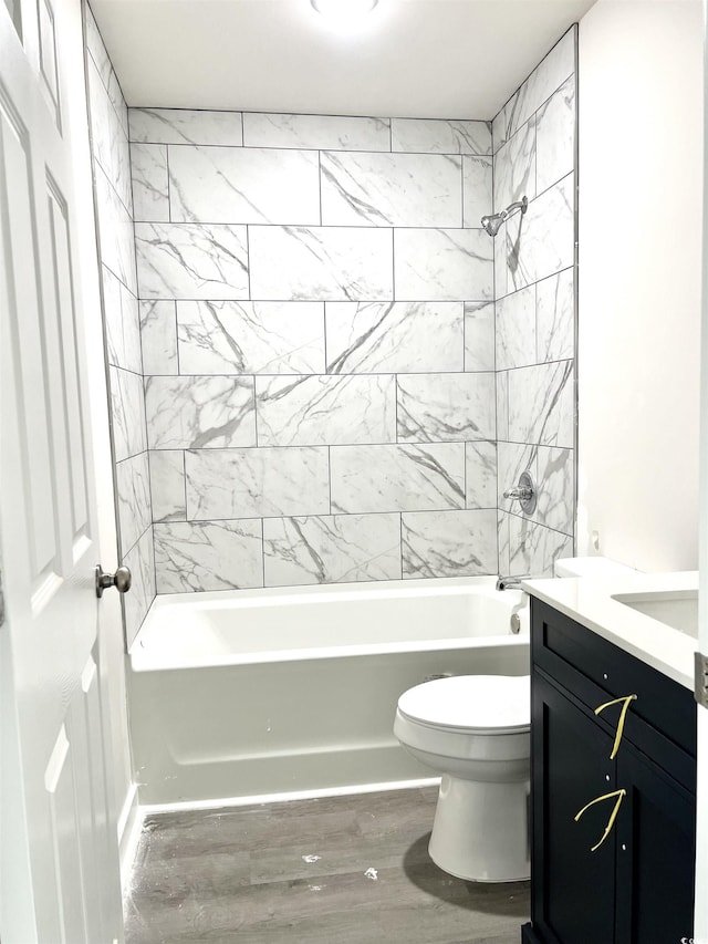 6306 Somerset Dr, Myrtle Beach, SC 29572 - bathroom featuring toilet, wood finished floors, vanity, and washtub / shower combination