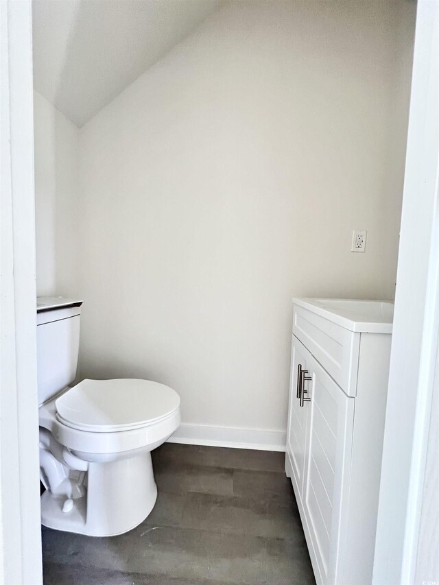 6306 Somerset Dr, Myrtle Beach, SC 29572 - bathroom with toilet, wood finished floors, vanity, and baseboards