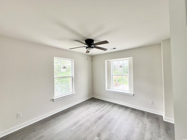 6306 Somerset Dr, Myrtle Beach, SC 29572 - unfurnished room with dark wood-type flooring, baseboards, and plenty of natural light