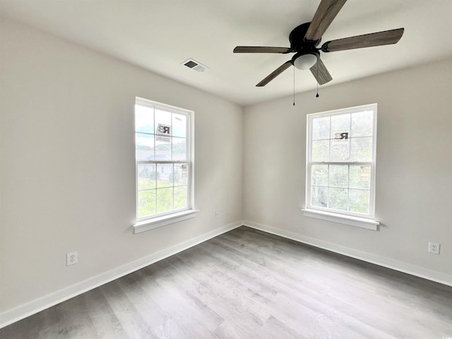 6306 Somerset Dr, Myrtle Beach, SC 29572 - unfurnished room featuring dark wood finished floors, baseboards, a ceiling fan, and visible vents