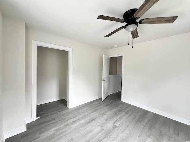 6306 Somerset Dr, Myrtle Beach, SC 29572 - unfurnished bedroom featuring baseboards, a ceiling fan, and wood finished floors