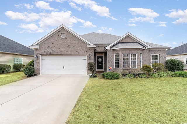 view of front of property with a garage and a front yard