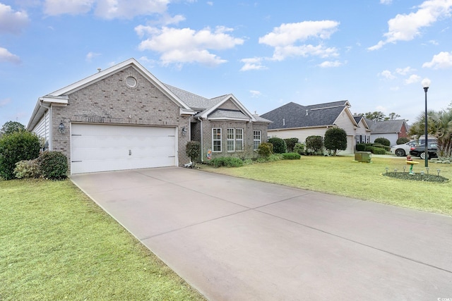 ranch-style home featuring a garage and a front lawn