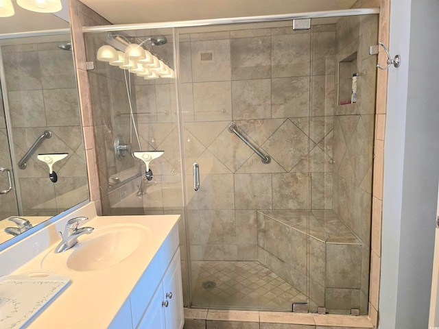 bathroom with vanity and walk in shower