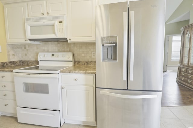 kitchen featuring white appliances, backsplash, white cabinetry, and light hardwood / wood-style flooring