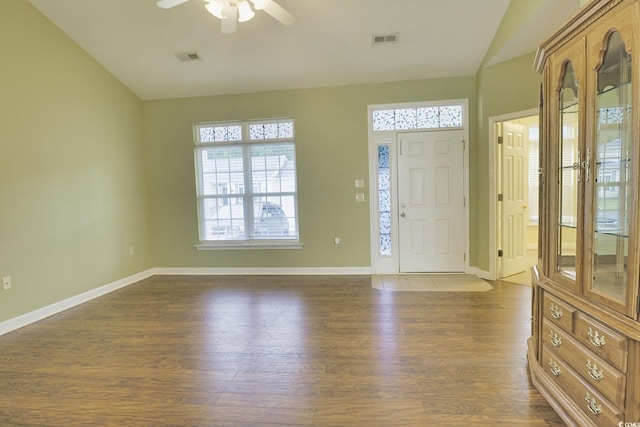 foyer with dark wood-type flooring, ceiling fan, and vaulted ceiling