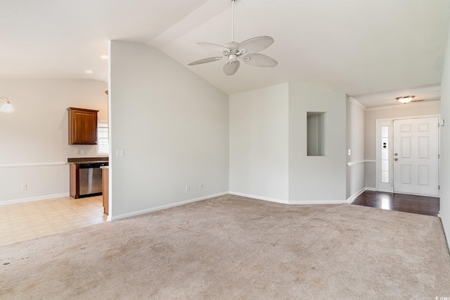 unfurnished living room with ceiling fan, light carpet, and vaulted ceiling