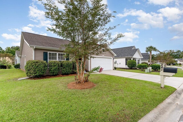 single story home with a front yard and a garage