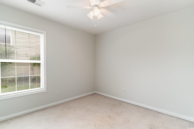 carpeted empty room with ceiling fan