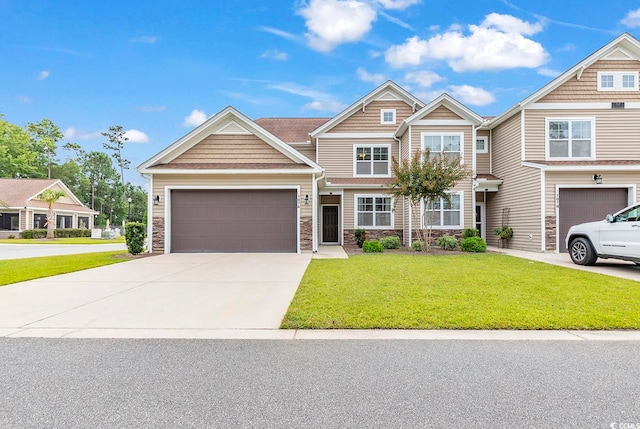 view of front of property with a front yard and a garage