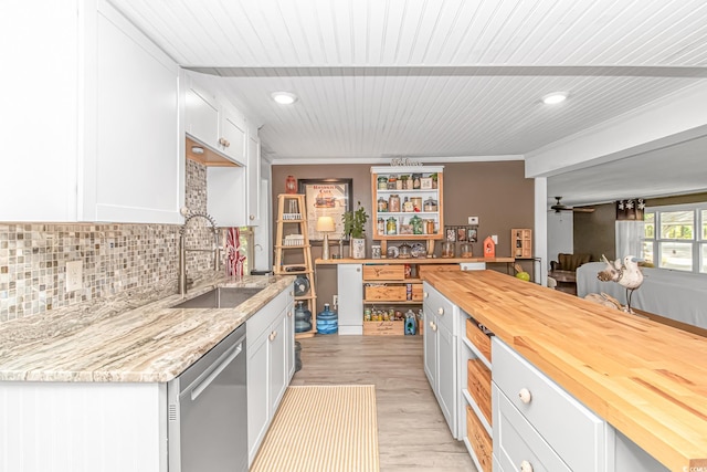 kitchen with ceiling fan, sink, wooden counters, dishwasher, and light hardwood / wood-style floors