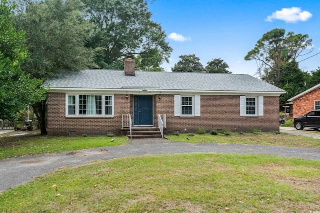 ranch-style house with a front yard