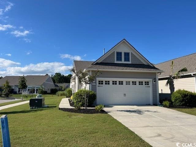 view of side of home featuring concrete driveway and a lawn