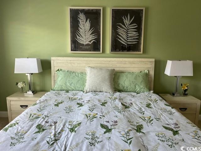 bedroom featuring baseboards