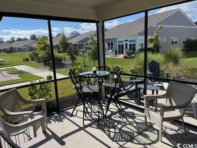 sunroom / solarium with outdoor dining space