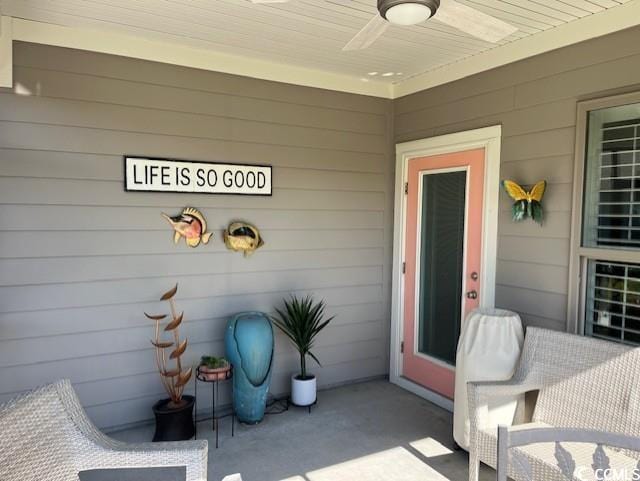 doorway to property with a ceiling fan