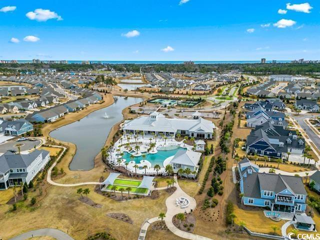 drone / aerial view featuring a water view and a residential view