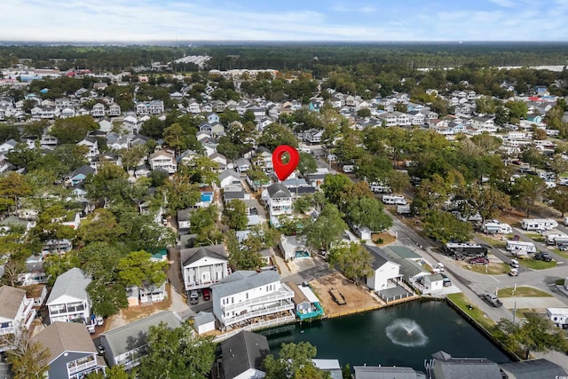 drone / aerial view with a residential view and a water view