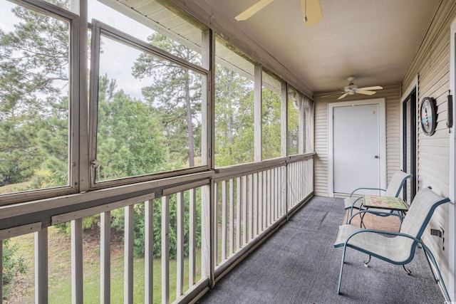 sunroom with plenty of natural light and ceiling fan