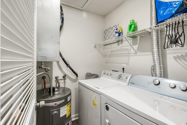 laundry area featuring separate washer and dryer and electric water heater