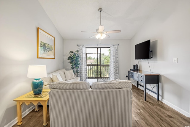 living room with ceiling fan, hardwood / wood-style flooring, and vaulted ceiling