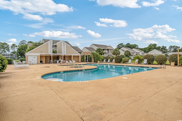 view of swimming pool with a patio area