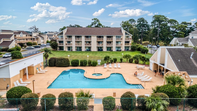 view of swimming pool with a yard and a patio