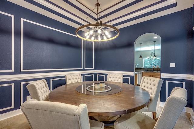 dining room with light tile patterned floors, sink, and a chandelier