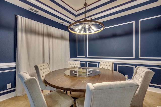 dining area with light tile patterned floors and a chandelier