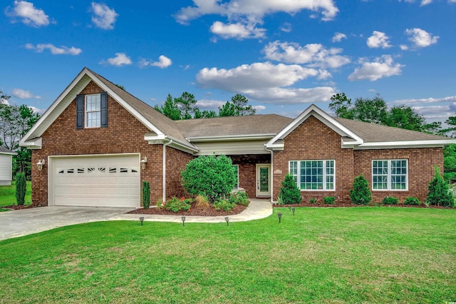 view of front facade with a garage and a front lawn