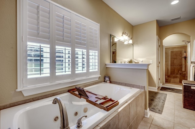 bathroom with tile patterned flooring and plus walk in shower