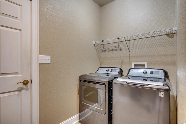 laundry area with washing machine and dryer