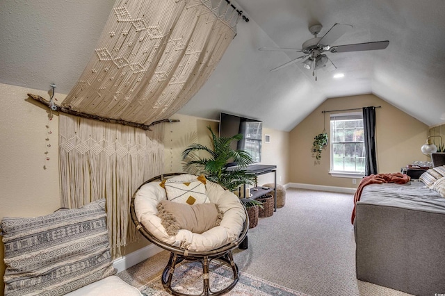 bedroom featuring carpet flooring, lofted ceiling, and ceiling fan