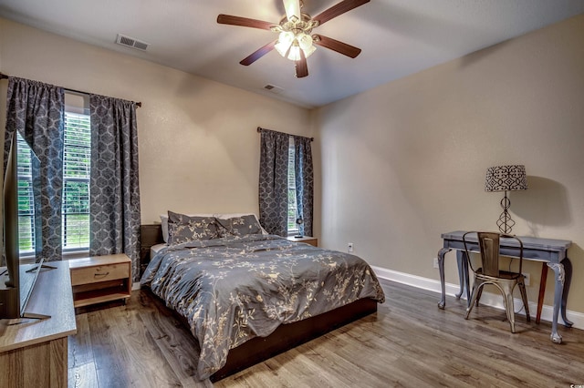 bedroom featuring hardwood / wood-style floors and ceiling fan