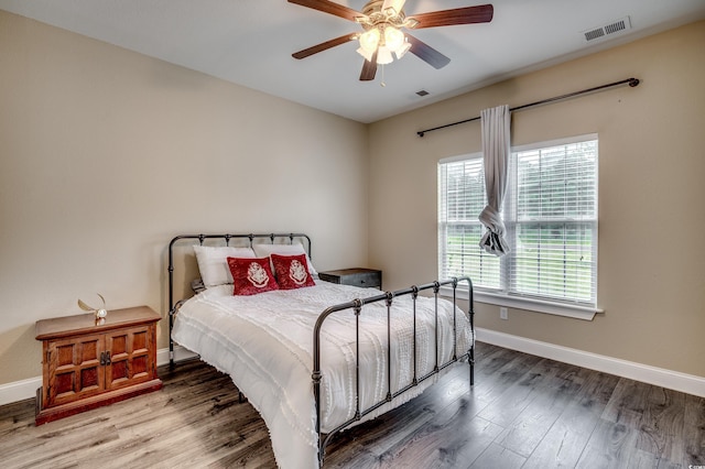 bedroom featuring ceiling fan and hardwood / wood-style flooring