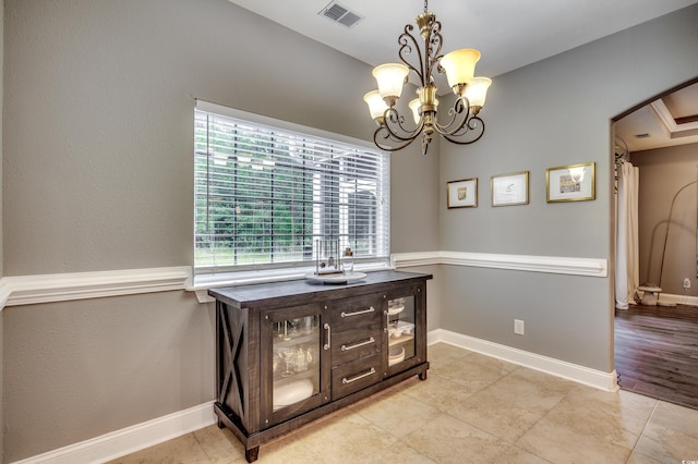 interior space featuring an inviting chandelier and light wood-type flooring