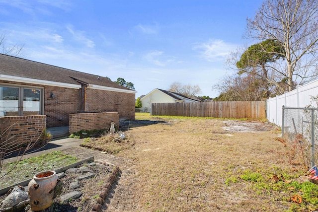 view of yard featuring a fenced backyard