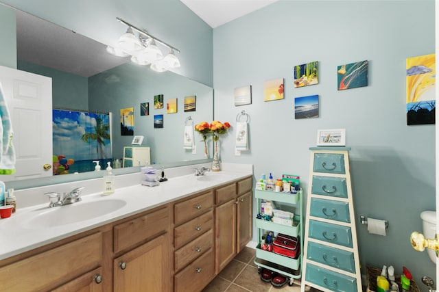 bathroom with tile patterned floors and vanity