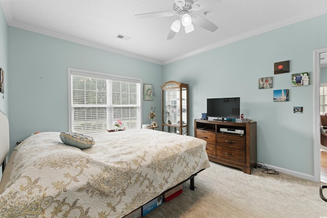 bedroom featuring multiple windows, carpet, ornamental molding, and ceiling fan