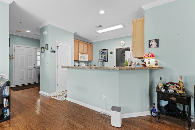 kitchen with light brown cabinetry, ornamental molding, dark wood-type flooring, and kitchen peninsula