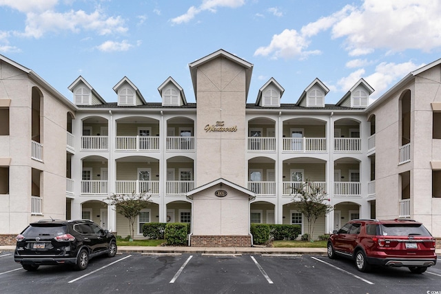 1009 World Tour Blvd Unit 301, Myrtle Beach, SC 29579 - view of building exterior with uncovered parking