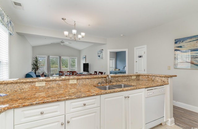 kitchen with white cabinets, white dishwasher, lofted ceiling, sink, and light wood-type flooring